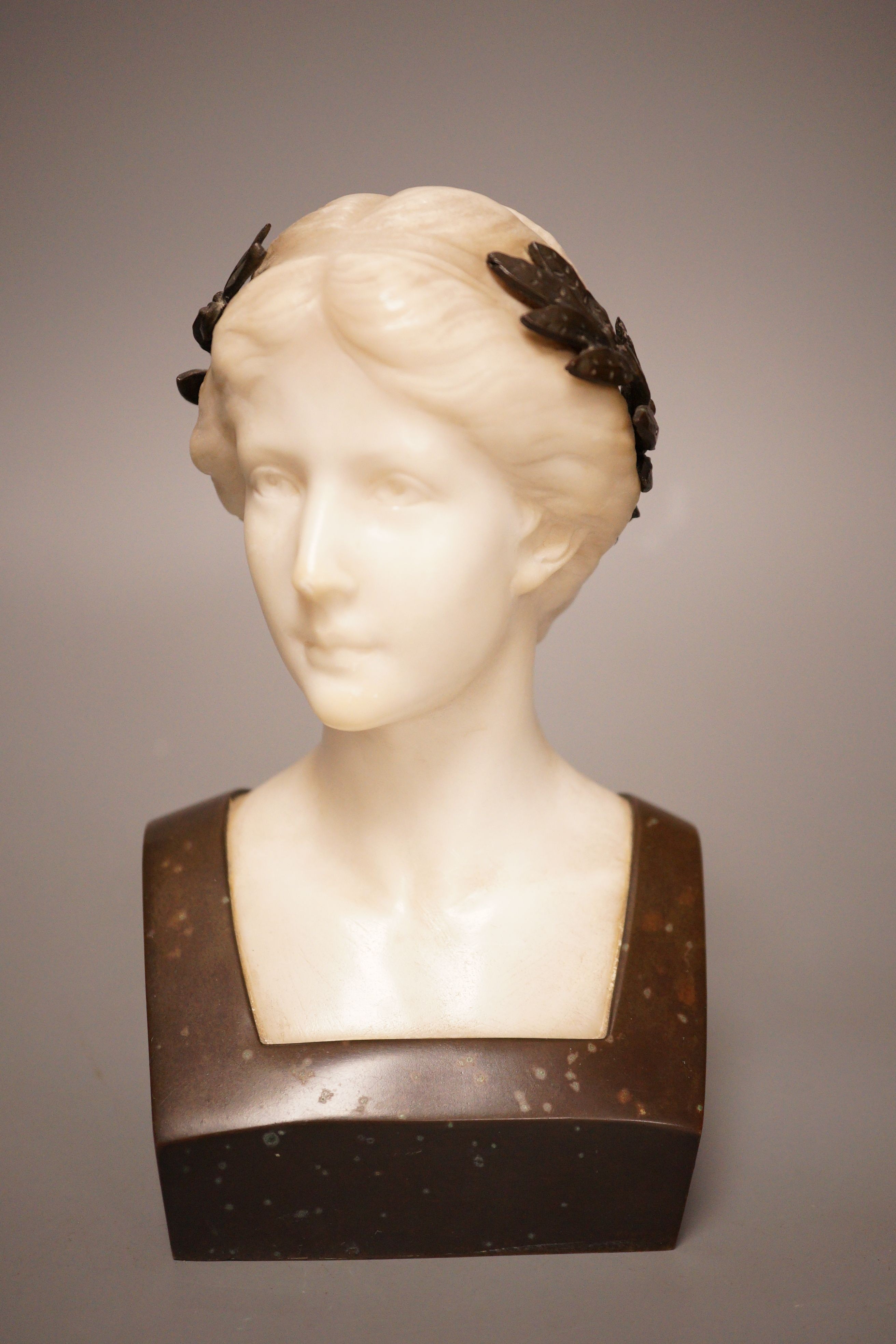 A late 19th/early 20th century French bronze and alabaster bust of a lady, 19cm